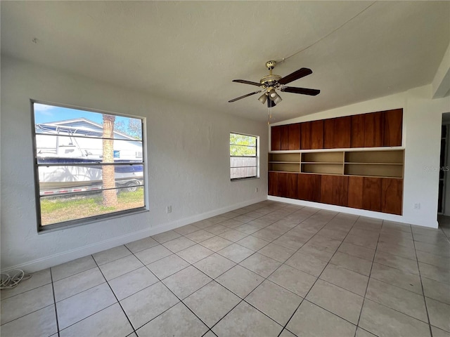 7563 Meadowlawn Dr N, Saint Petersburg, FL 33702 - empty room featuring built in shelves and ceiling fan
