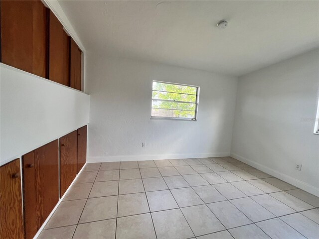 7563 Meadowlawn Dr N, Saint Petersburg, FL 33702 - spare room with light tile patterned flooring