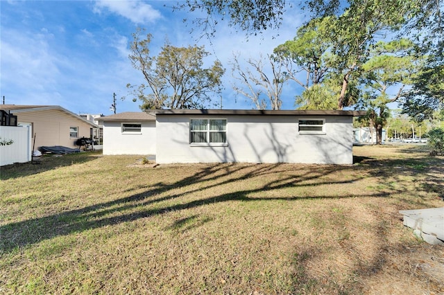 back of house with a yard