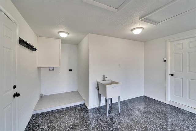 washroom featuring a textured ceiling