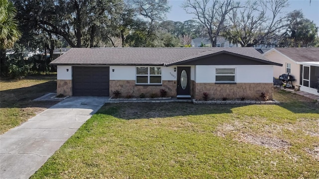 ranch-style house with a garage and a front lawn