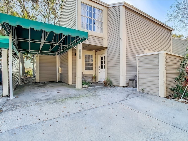 exterior space with a carport