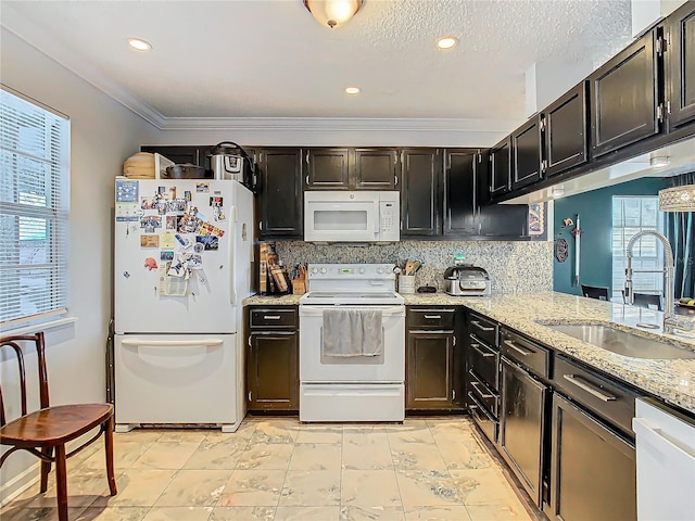 kitchen featuring crown molding, white appliances, sink, and decorative backsplash