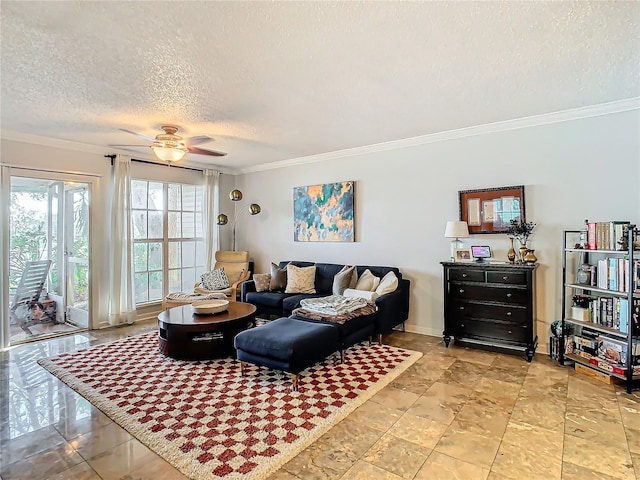 living room with ceiling fan, ornamental molding, and a textured ceiling