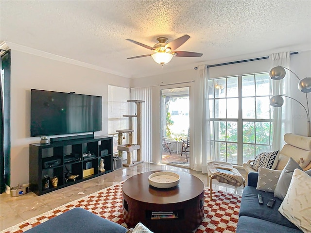 living room featuring ceiling fan and a textured ceiling