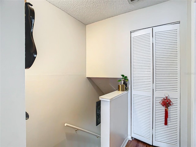 interior space featuring a textured ceiling