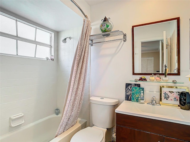 full bathroom featuring vanity, toilet, and shower / bath combo with shower curtain