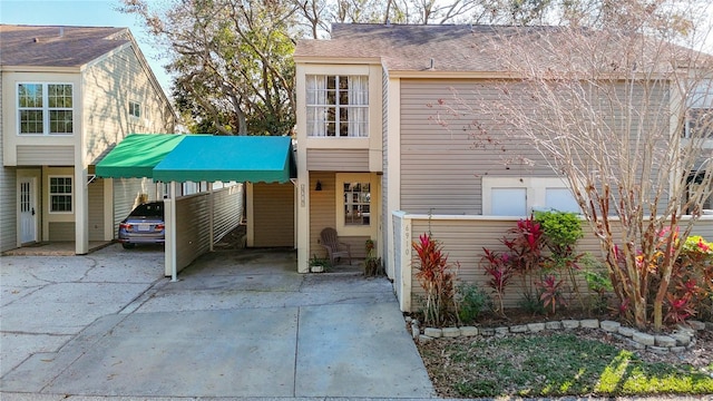 view of front of home with a carport