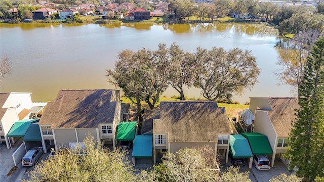 birds eye view of property with a water view