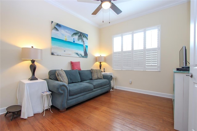 living room with ceiling fan, ornamental molding, and hardwood / wood-style floors