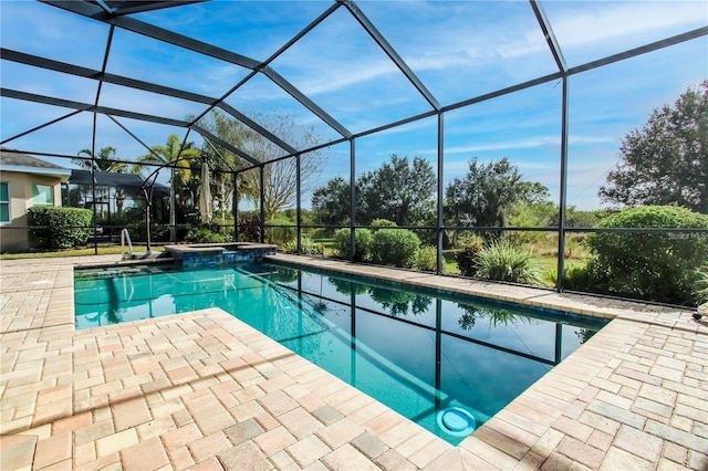 view of pool with a patio and glass enclosure