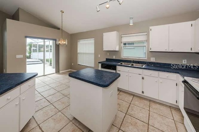 kitchen with lofted ceiling, sink, a center island, range with electric stovetop, and white cabinets