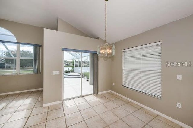 unfurnished dining area featuring lofted ceiling, light tile patterned floors, and a chandelier