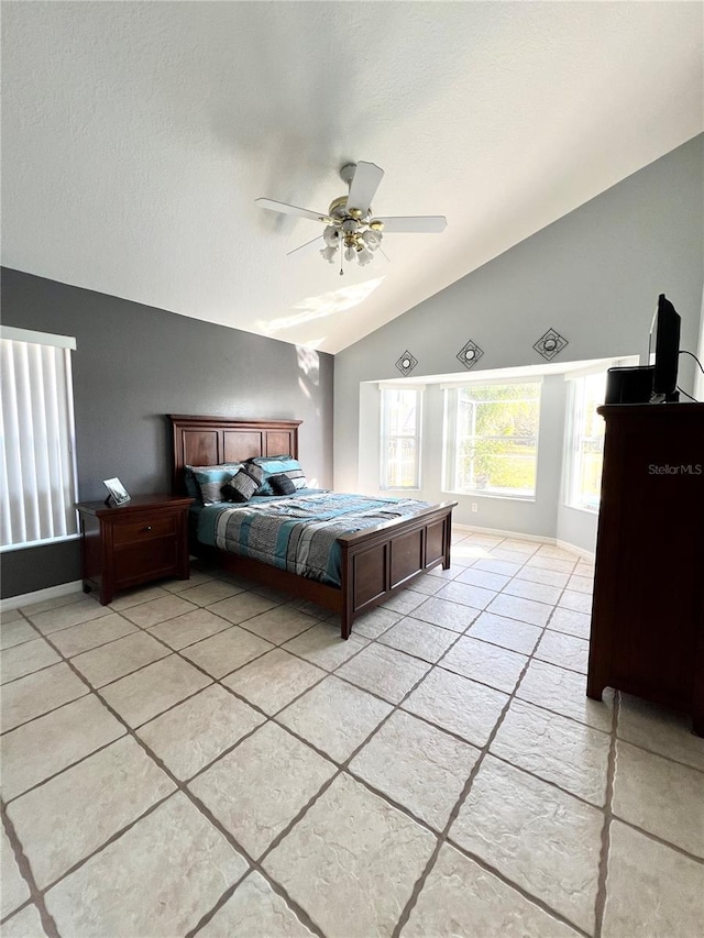 unfurnished bedroom featuring ceiling fan, vaulted ceiling, and a textured ceiling