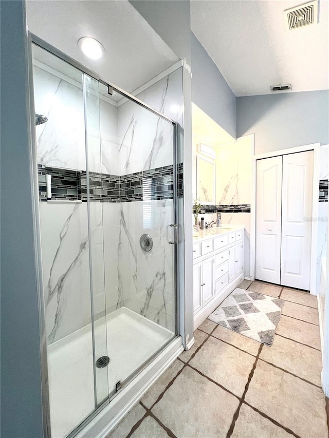 bathroom featuring vanity and walk in shower