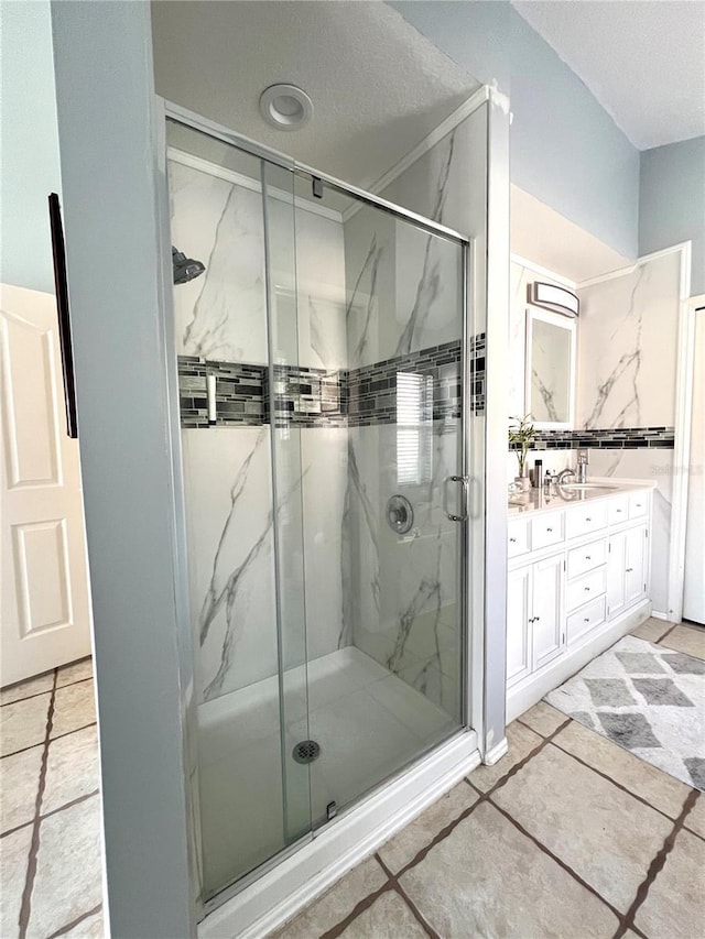 bathroom featuring vanity and a shower with shower door