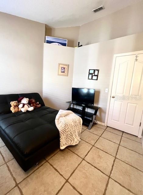 bedroom with light tile patterned flooring