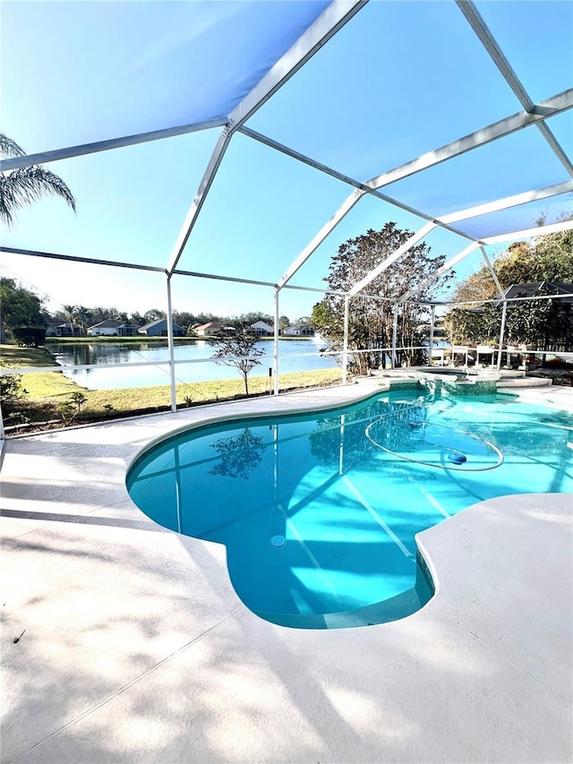 view of pool with a water view and glass enclosure