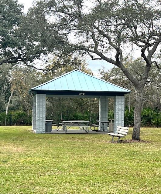 view of property's community with a gazebo and a lawn