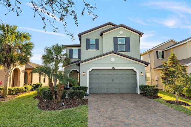 view of front of house featuring a garage and a front yard