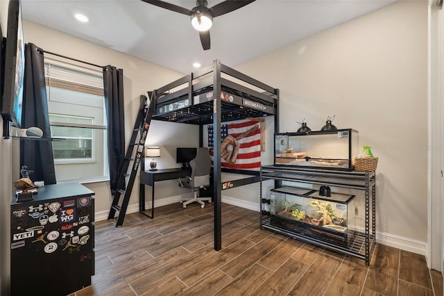 bedroom featuring hardwood / wood-style flooring and ceiling fan