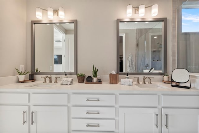 bathroom with vanity and an enclosed shower