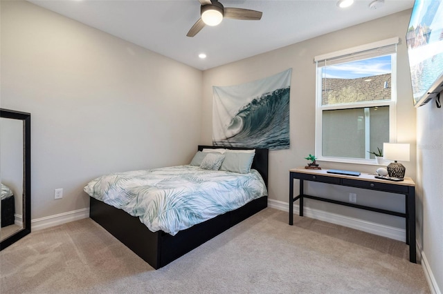 bedroom with light colored carpet and ceiling fan