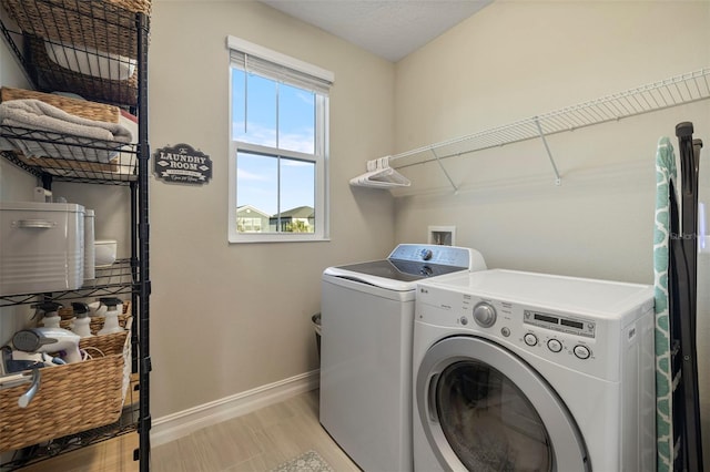 washroom featuring separate washer and dryer