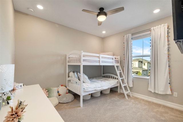 carpeted bedroom featuring ceiling fan