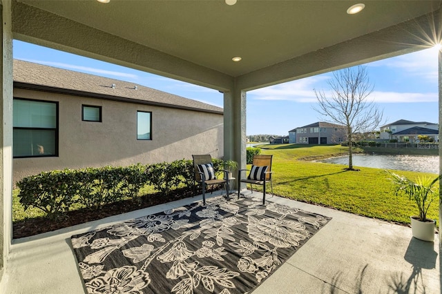 view of patio featuring a water view