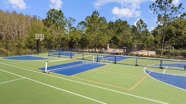 view of basketball court featuring tennis court