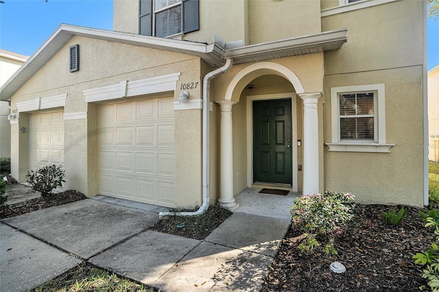 doorway to property featuring a garage