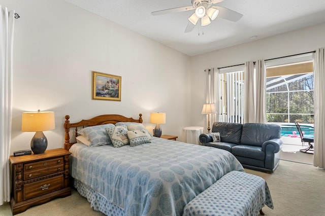 bedroom with a ceiling fan, access to outside, and light colored carpet