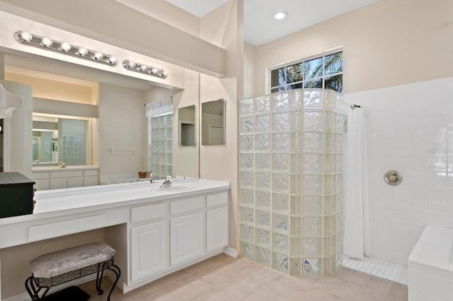 full bath featuring vanity, tile patterned floors, recessed lighting, and walk in shower