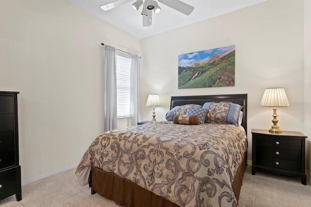 carpeted bedroom featuring a ceiling fan and baseboards