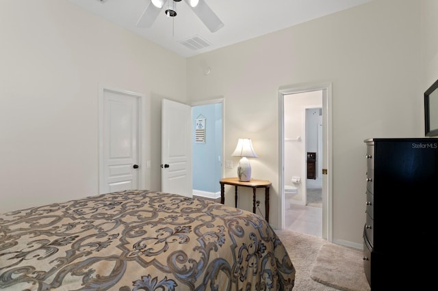 bedroom with visible vents, a ceiling fan, ensuite bathroom, carpet floors, and baseboards