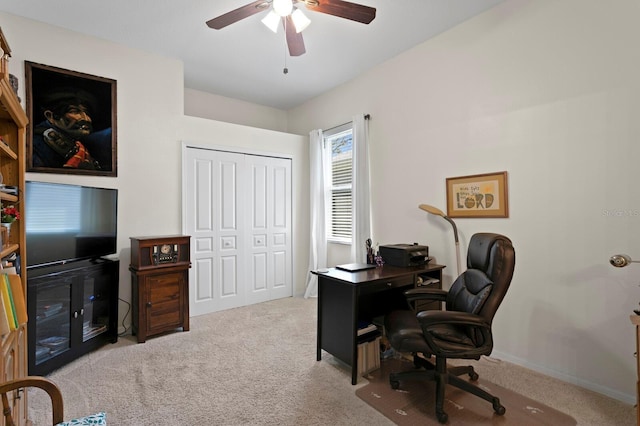 carpeted office featuring a ceiling fan