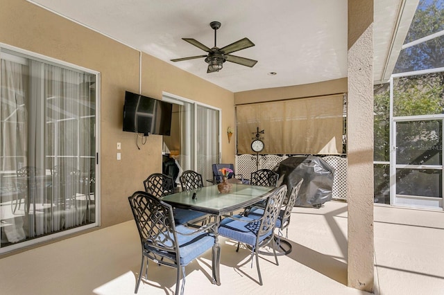 view of patio featuring outdoor dining area, grilling area, and ceiling fan