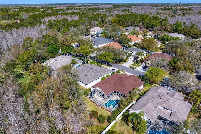 aerial view featuring a residential view and a view of trees