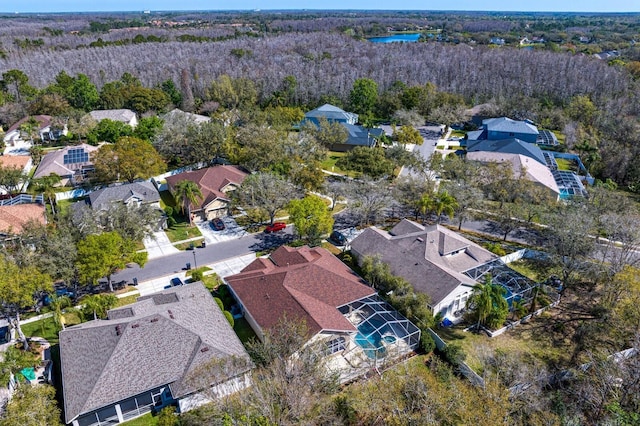 birds eye view of property with a residential view and a water view