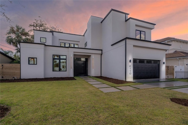 contemporary house with a lawn