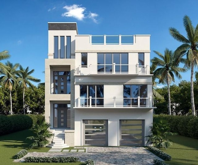 contemporary home with a balcony and a garage