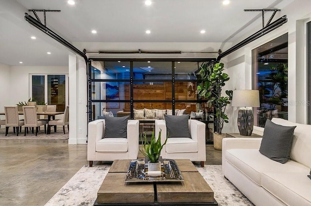 living room with concrete flooring