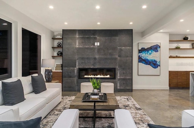 living room with a tiled fireplace