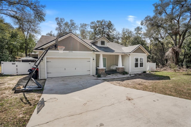 view of front of property featuring a garage and a front yard