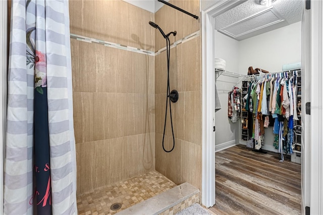 bathroom featuring hardwood / wood-style floors and curtained shower