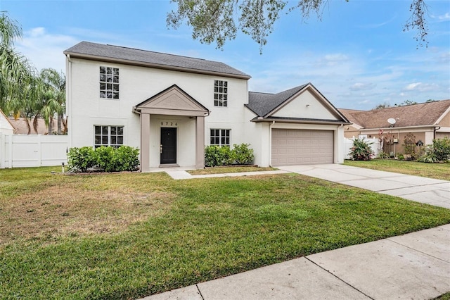 view of front of property featuring a garage and a front yard