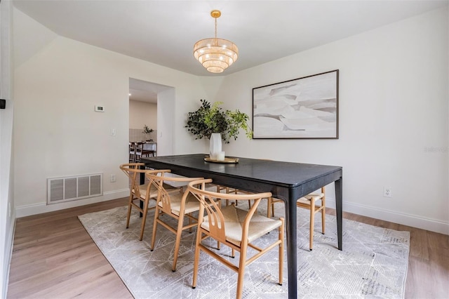 dining area with light hardwood / wood-style floors