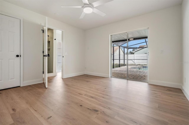 spare room featuring ceiling fan and light hardwood / wood-style flooring