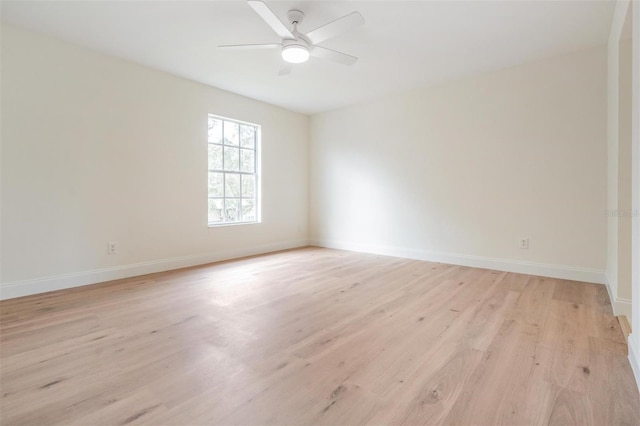 spare room featuring ceiling fan and light hardwood / wood-style flooring